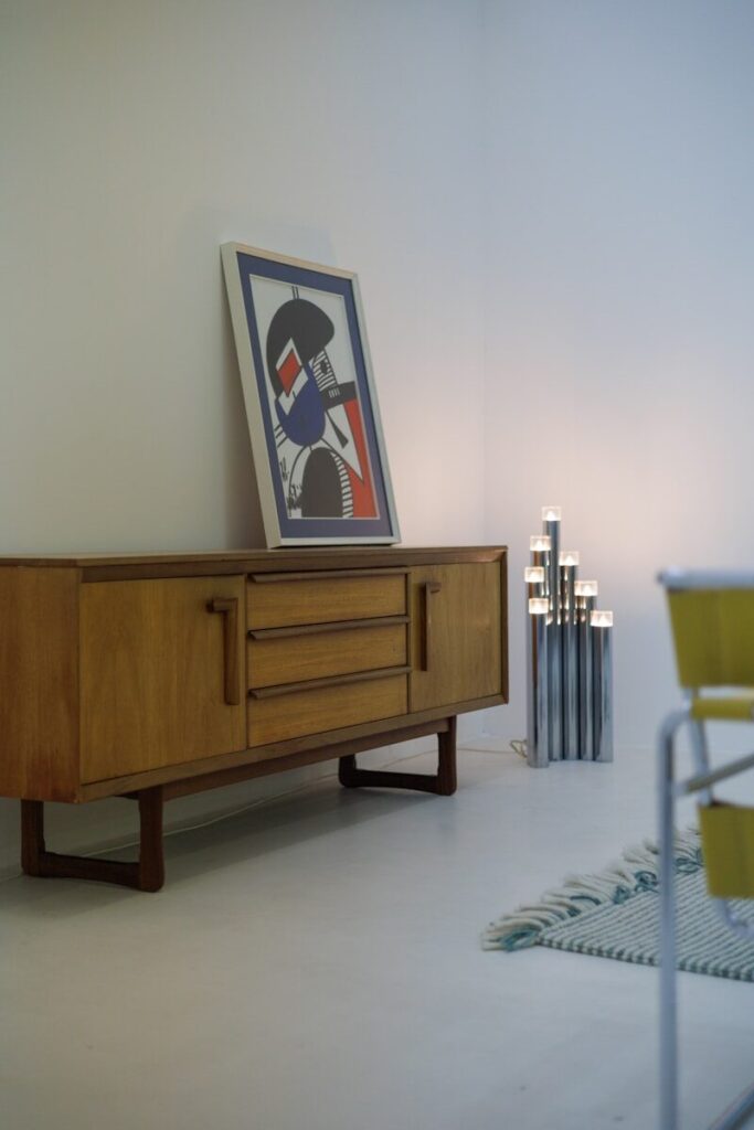 Fine art painting and vintage dresser at Southeast Michigan estate sale